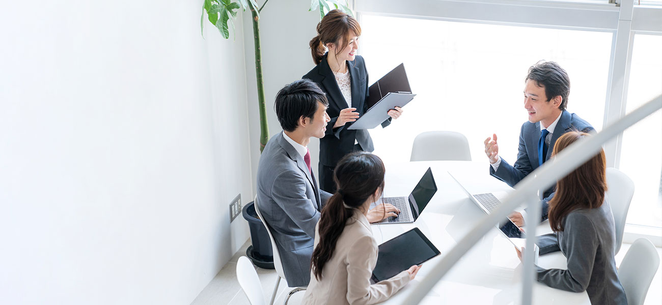 people discussing a corporate meeting