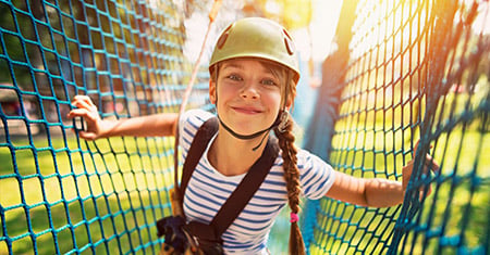 child on jungle ropes