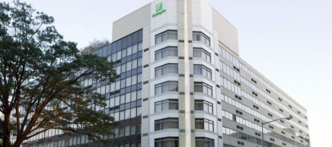 view of hotel with a tree